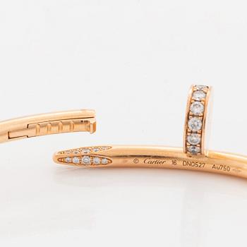 A Cartier "Juste en Clou" bracelet in 18K rose gold set with round brilliant-cut diamonds.