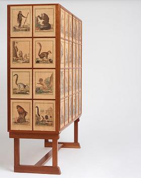 Josef Frank, 'Apskåpet' (The monkey cabinet), a rare cabinet covered with prints of different monkeys, Svenskt Tenn, Sweden ca 1941.