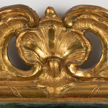 A rococo mirror, mid 18th century.
