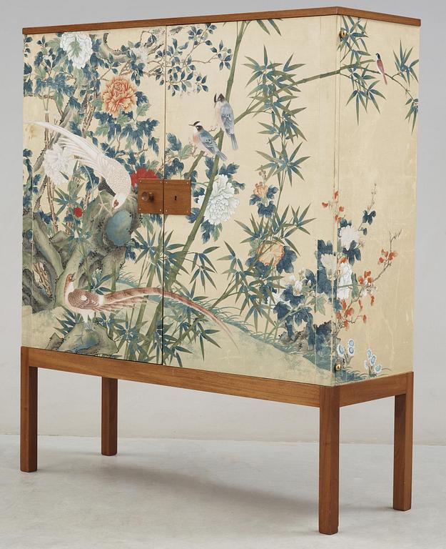 A Josef Frank mahogany cabinet, the sides and doors covered in handpainted wallpaper, Svenskt Tenn, circa 1950.