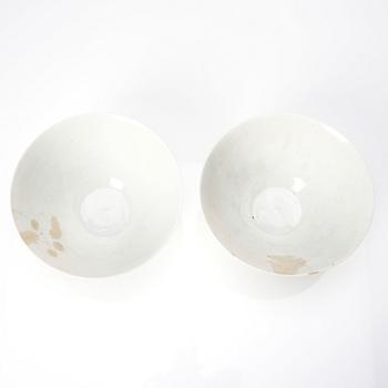 Two Chinese white glazed anhua decorated dragon bowls, Qing dynasty.