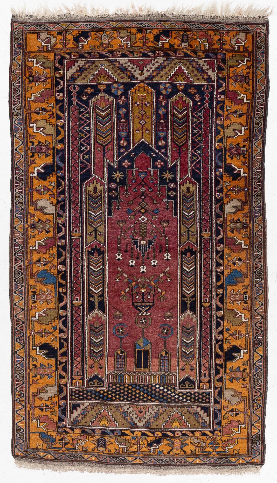 An Anatolian prayer rug, semi-antique, c. 205 x 115 cm.