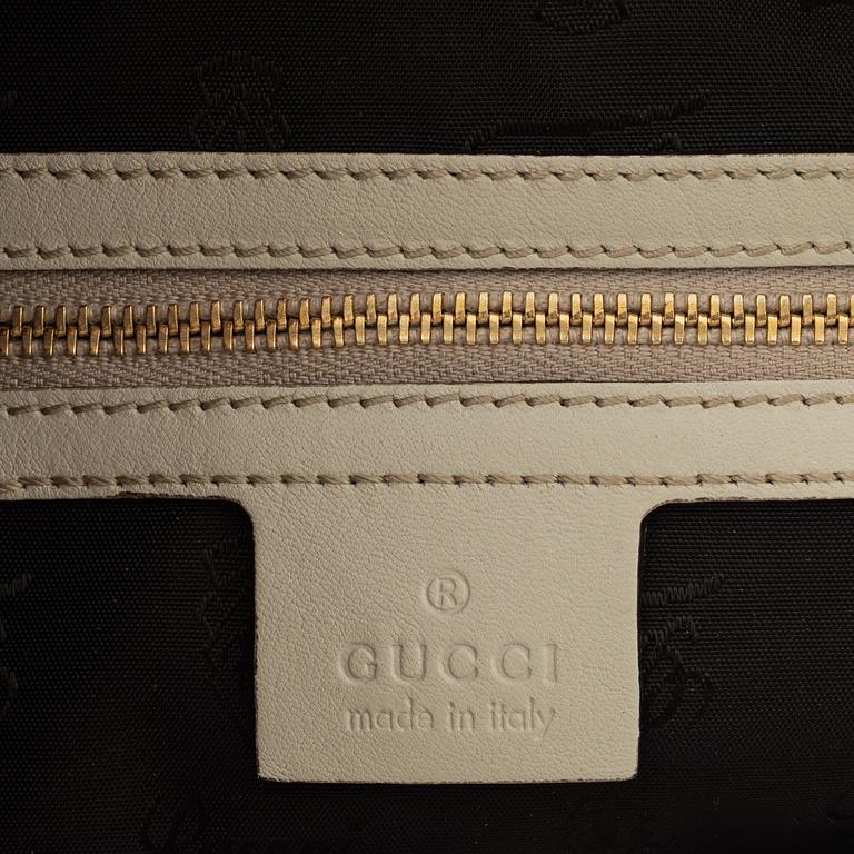 Gucci, a 'Pop Bamboo' python bag.