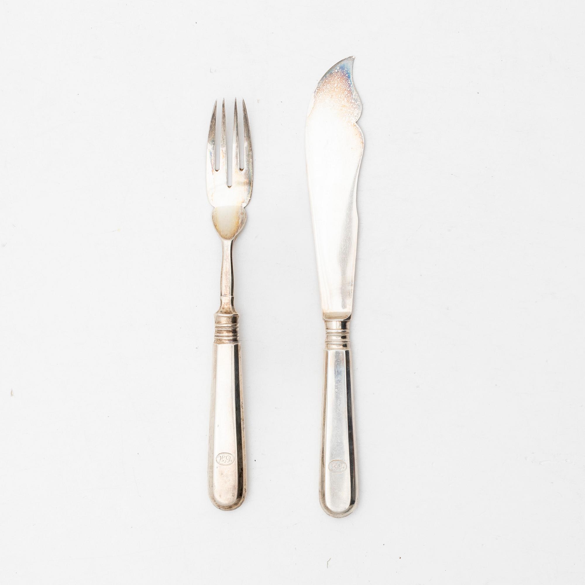 A Russian silver cutlery set, including mark of Ovchinnikov with the Imperial warrant, St Petersburg 1908-16 (24 pieces).