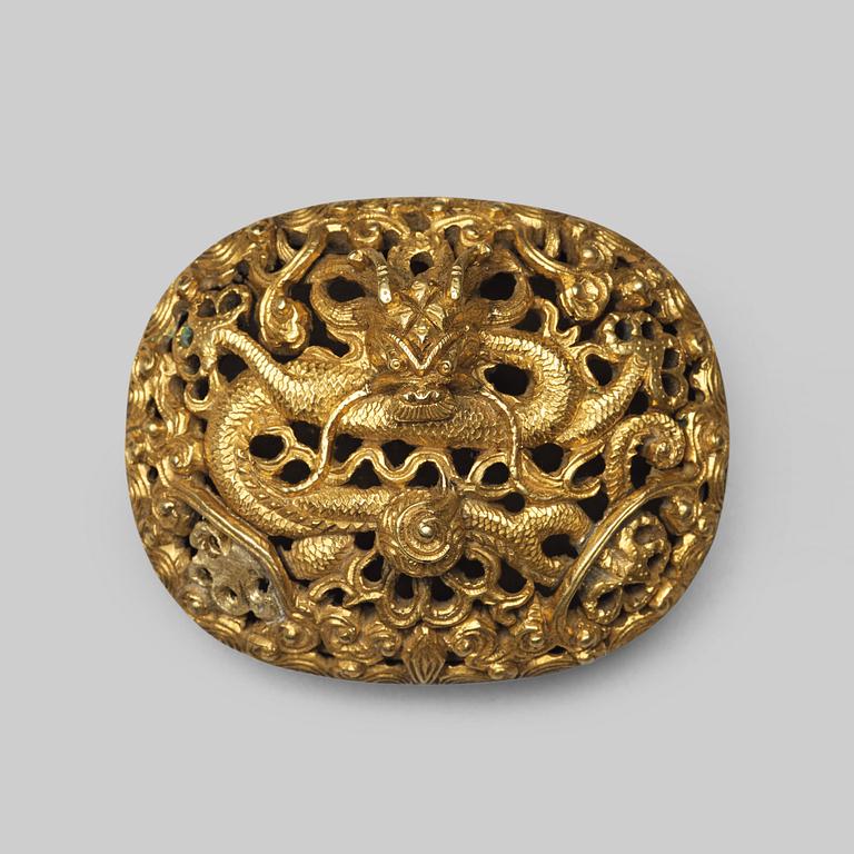 A gilt brass belt buckle, Qing dynasty, 19th Century.