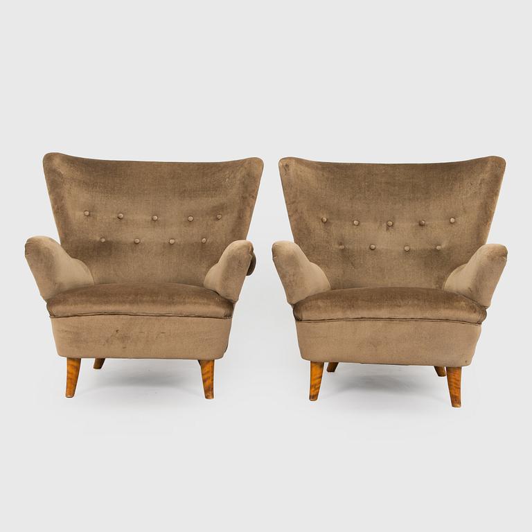 A pair of mid-20th century armchairs.