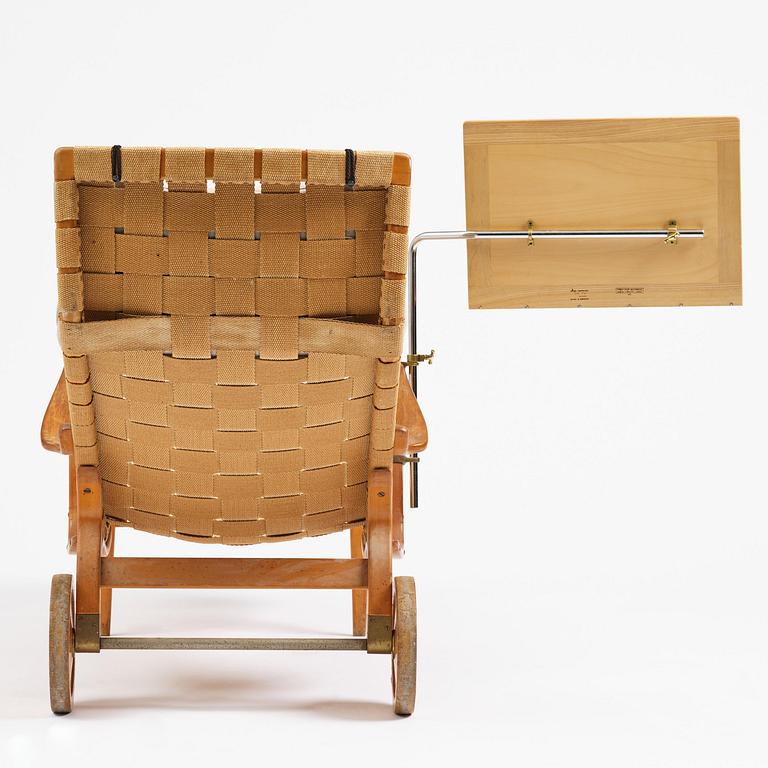 Bruno Mathsson, a lounge chair with wheels, Firma Karl Mathsson, Värnamo, 1940s, with reading table from 1972.