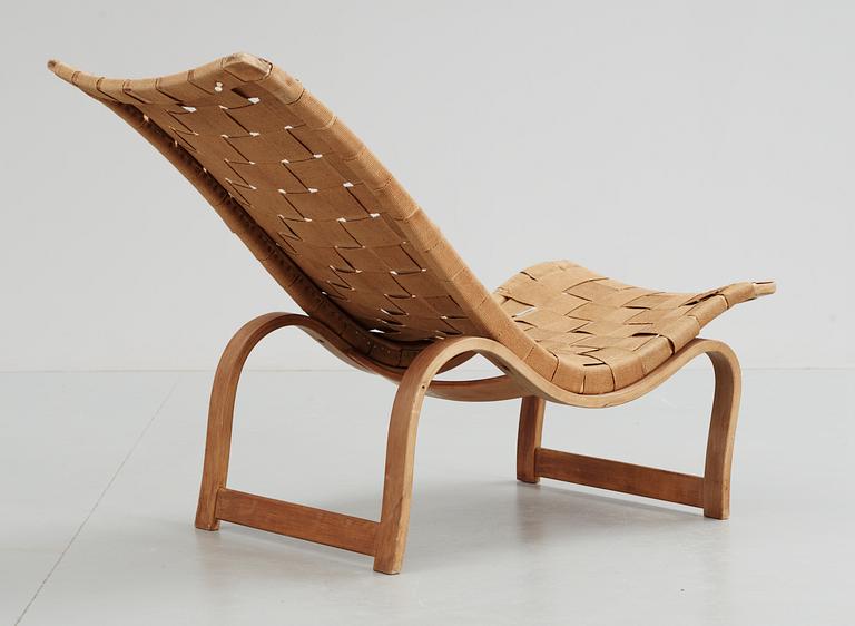 A Bruno Mathsson birch and canvas reclining chair, Karl Marthsson, Värnamo, Sweden 1936.
