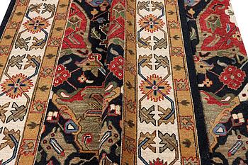 An oriental carpet with Mamluk design, c. 364 x 276 cm.