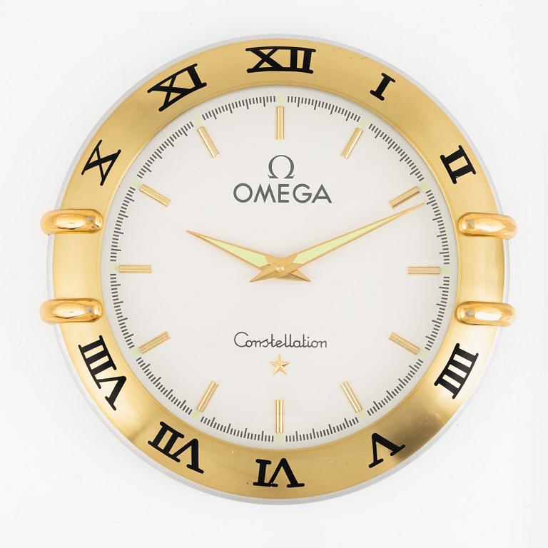 Butik/väggur, märkt "Omega Constellation", ca 35 cm.