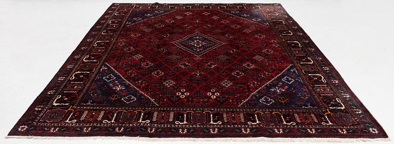 An oriental rug, c. 365 x 285 cm.
