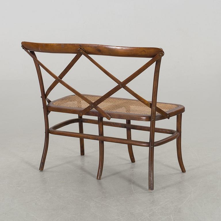 A wooden sofa, a table and four chairs, later part of the 20th century.