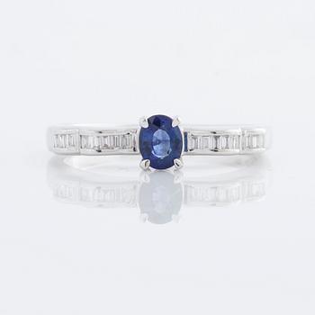 A sapphire and baguette cut diamond ring.