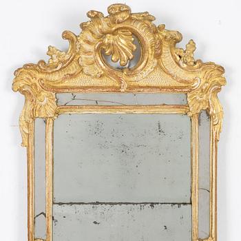 A giltwood rococo mirror, Stockholm, later part 18th century.