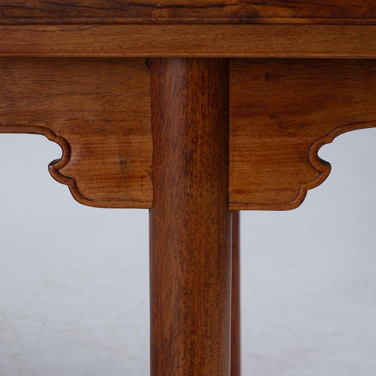 A Chinese hardwood dinner table and ten chairs with rattan seats, 20th century.