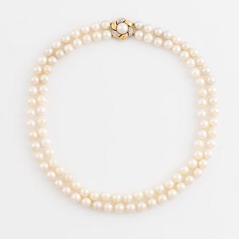 Two strand cultured pearl necklace, clasp 18K gold with half pearl and eight cut diamonds.