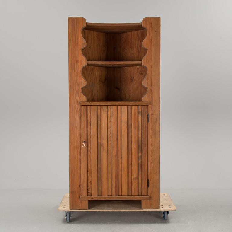 A corner cabinet by Axel Einar Hjorth.