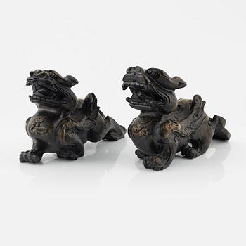 A pair of Chinese stone sculptures of mythical creatures, 20th Century.