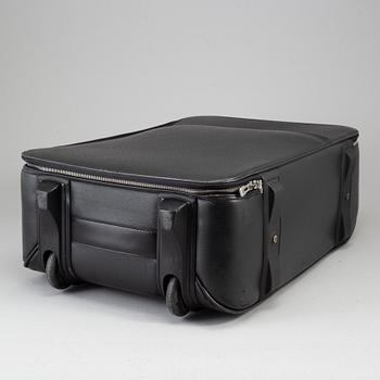 A black ardosie Leather Pégase 55 Suitcase.