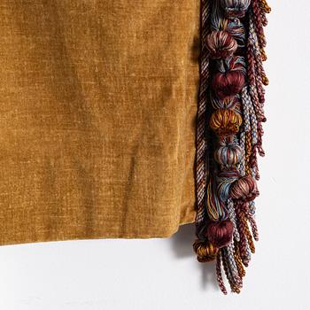 A pair of yellow velvet curtains from Brochier Como.