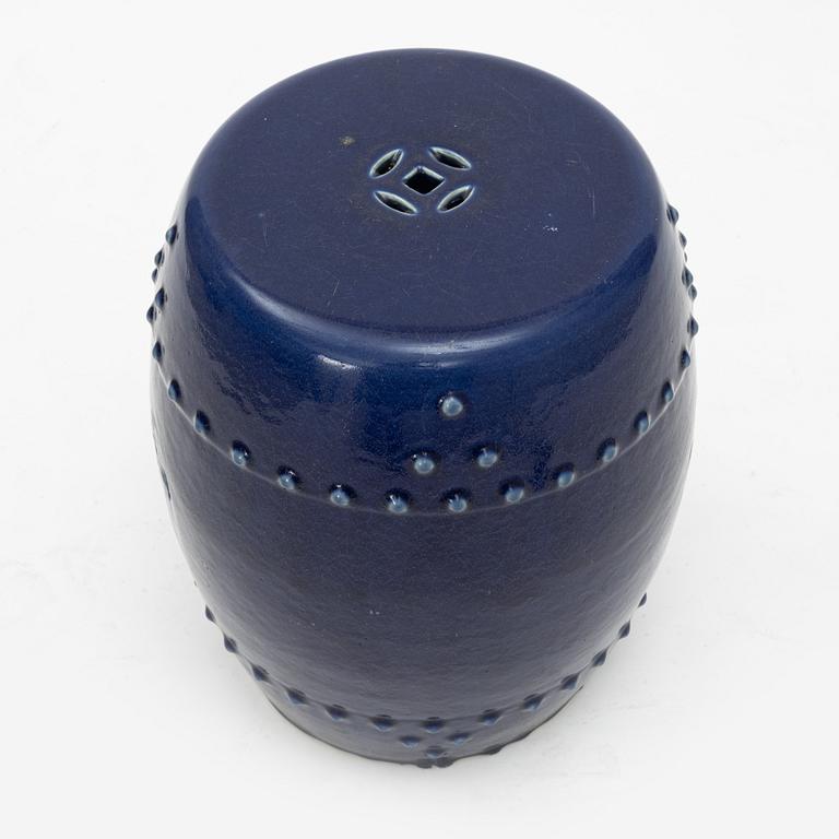 A barrel shaped Chinese blue glazed garden seat, 20th century.