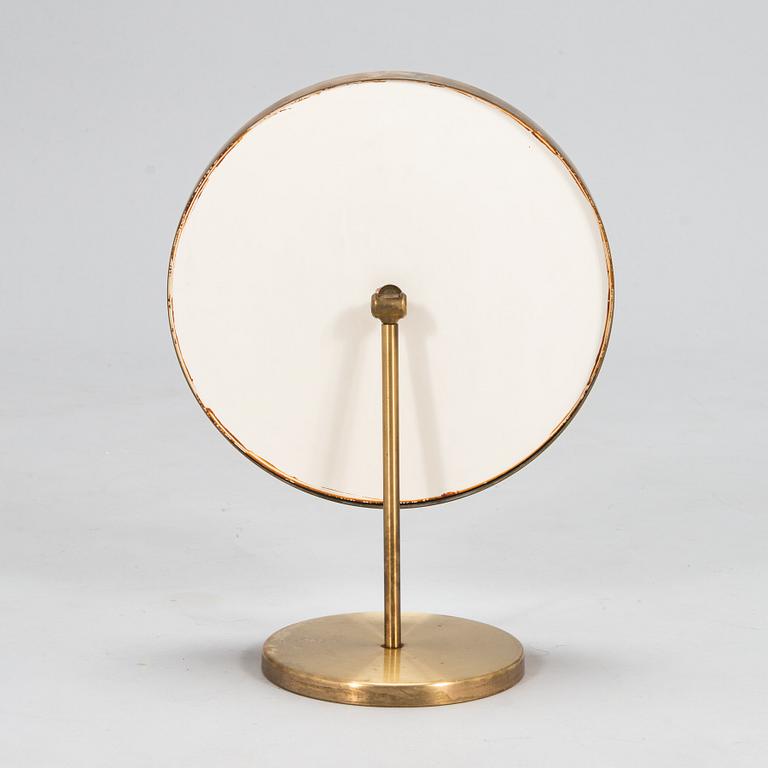 A brass table mirror, Glas Mäster, Markaryd, Sweden.