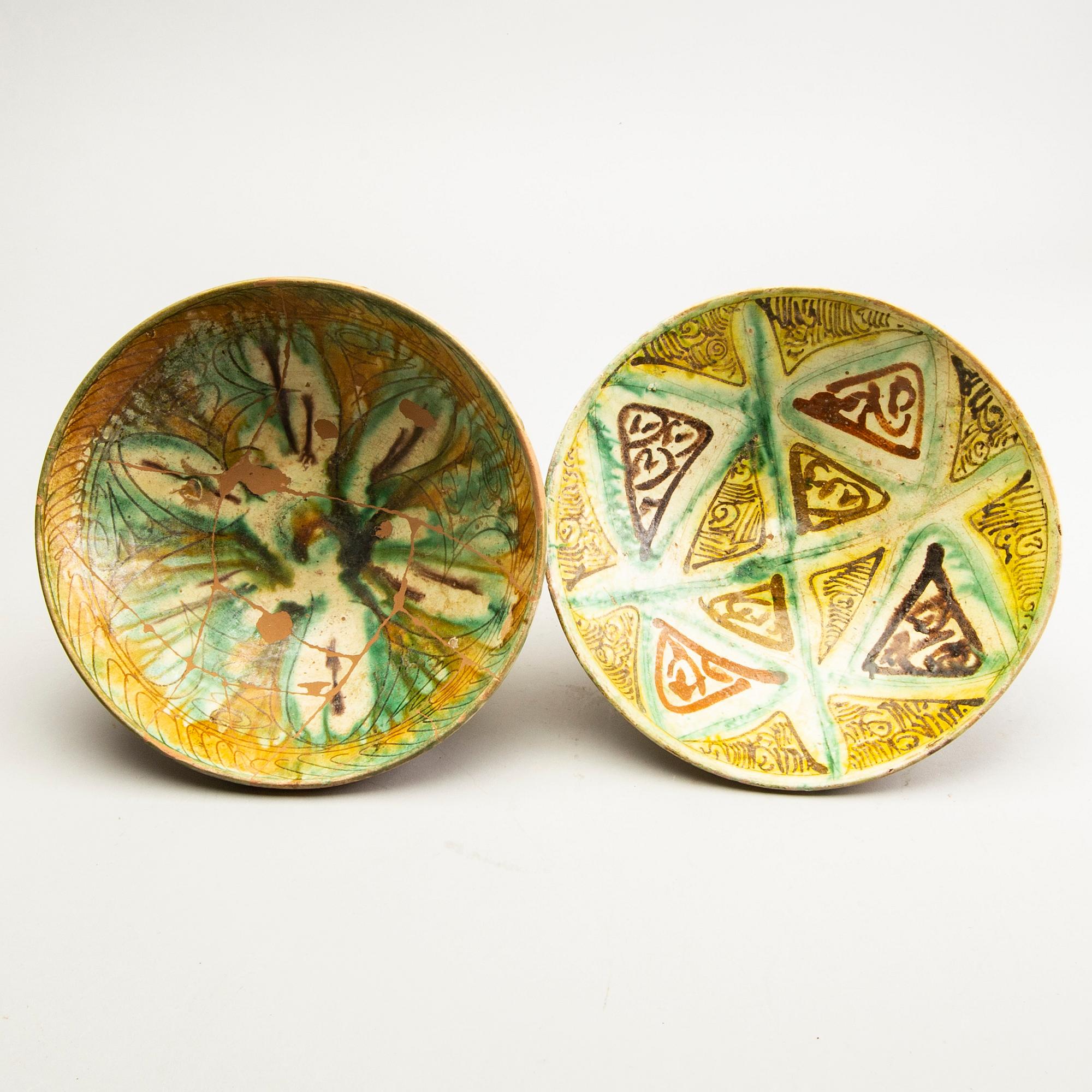 A group of Persian ceramics, some Nishapur-style Sgrafitto. (5 pieces).
