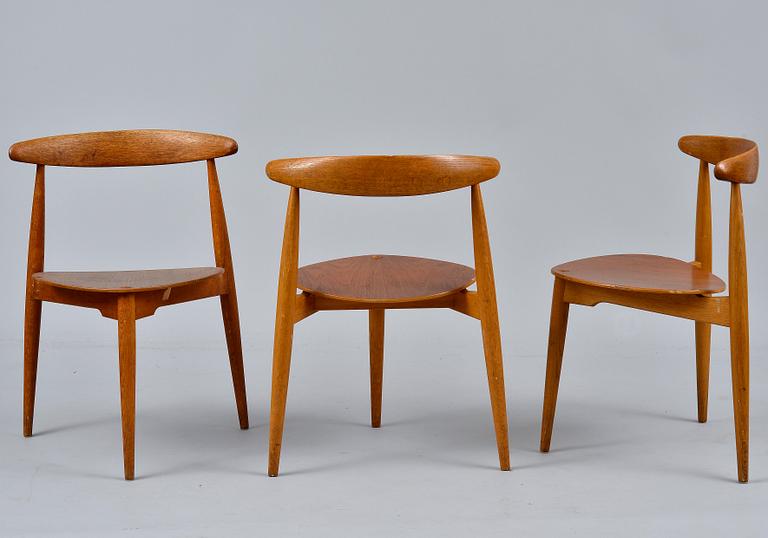 Hans J. Wegner, A SET OF SIX CHAIRS AND A TABLE, The Heart Chair. Beech and oak, teak on seats.