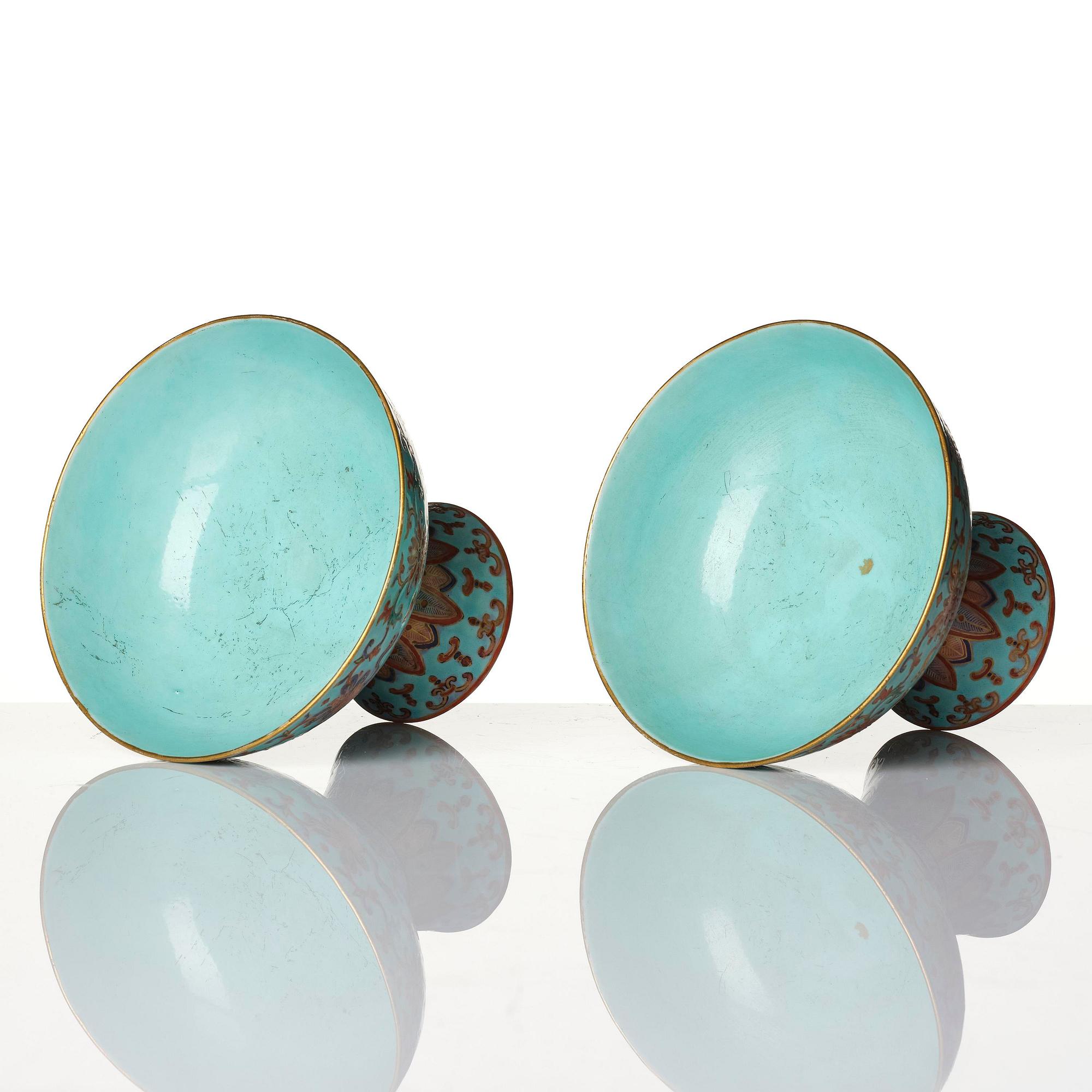 A pair of rare turquoise ground 'baijiaxiang' stemcups, Qing dynasty with Daoguang mark and period (1821-1850).