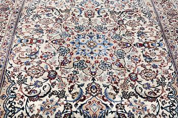 A Nain carpet, part silk, 9 laa, c. 318 x 209 cm.