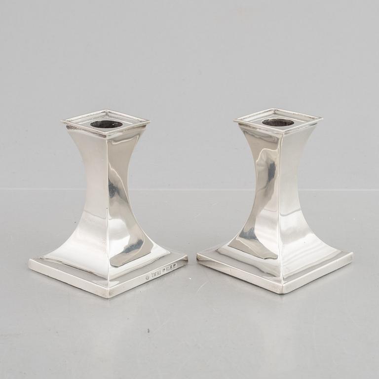 A pair of silver candlesticks, mark of William Hutton & Sons Ltd, Sheffield 1911-1912.