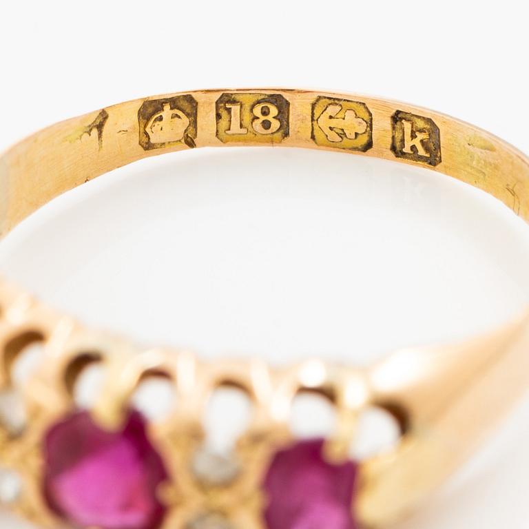 A ring 18K gold with rose-cut diamonds and red stones.