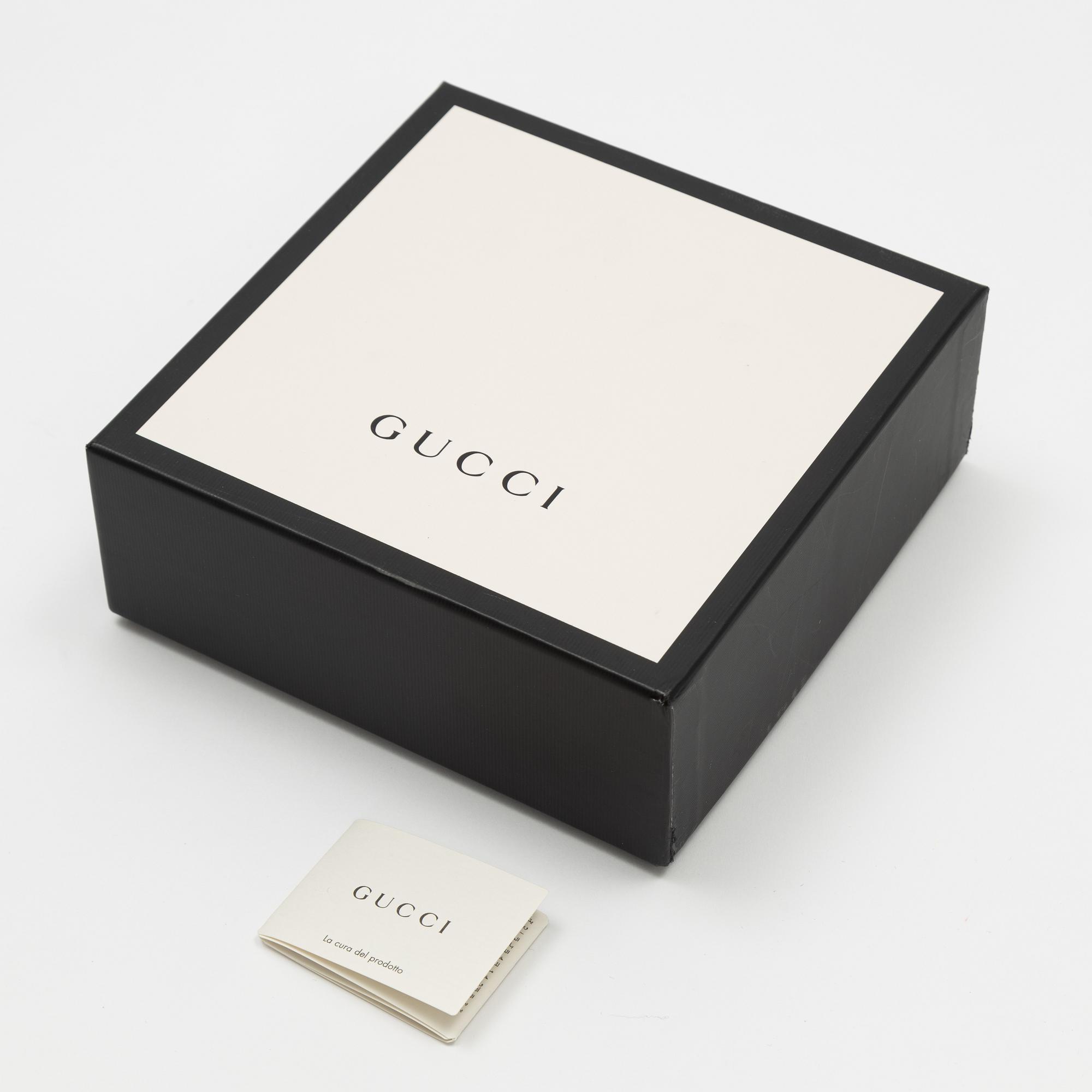 Gucci, a wool and silk mix "GG" jaquard shawl.
