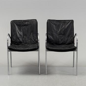 A pair of 1980s leather chairs.