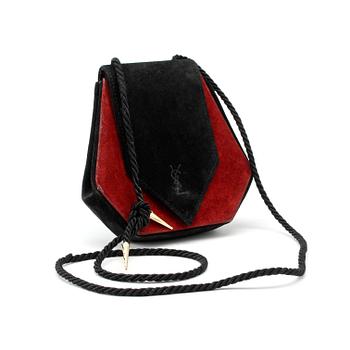 789. YVES SAINT LAURENT, a black and red suede shoulder bag from the 1960s.
