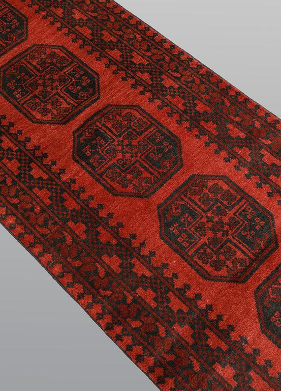 An Afghan runner, ca 383 x 78 cm.