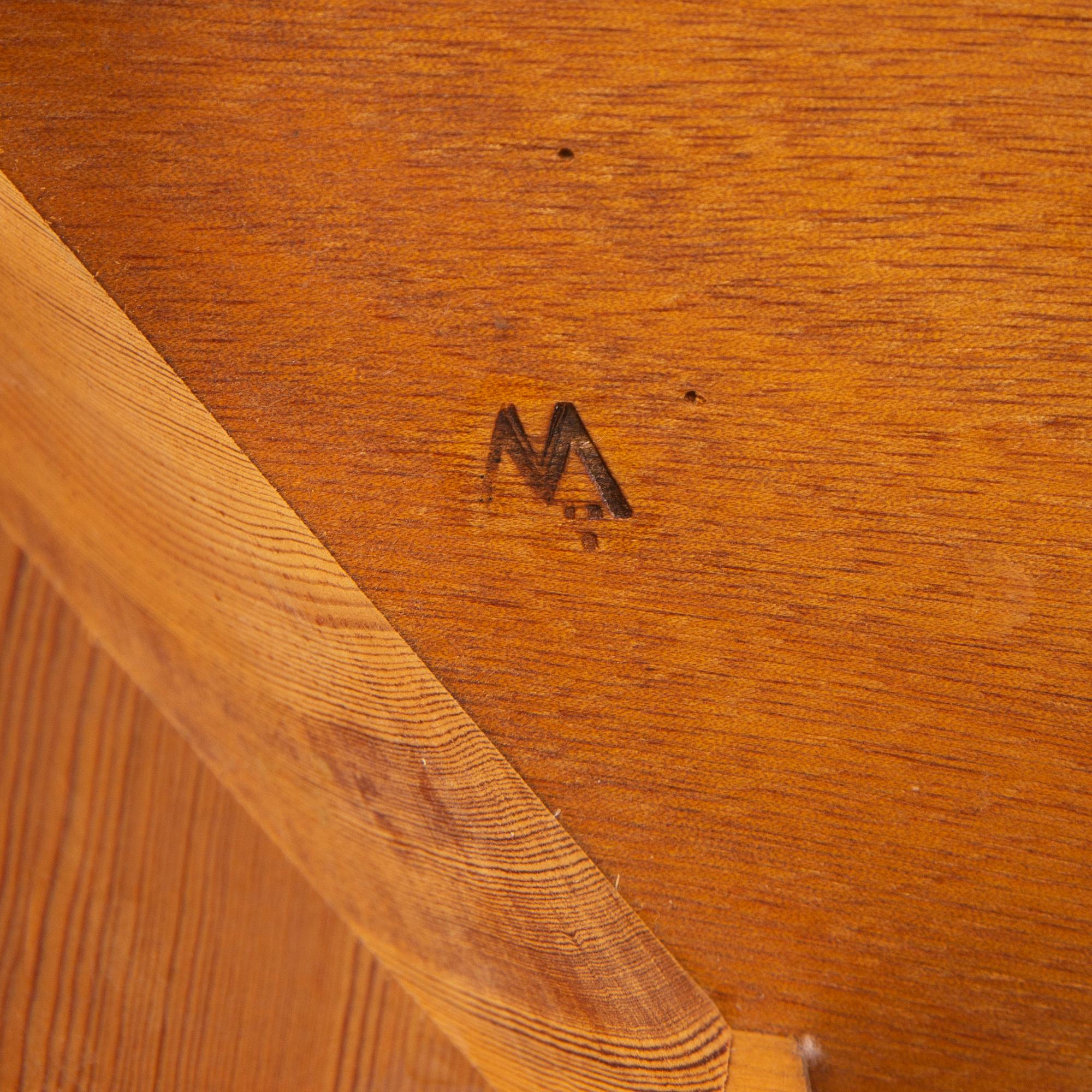 An oak coffee table with a later travertine top.