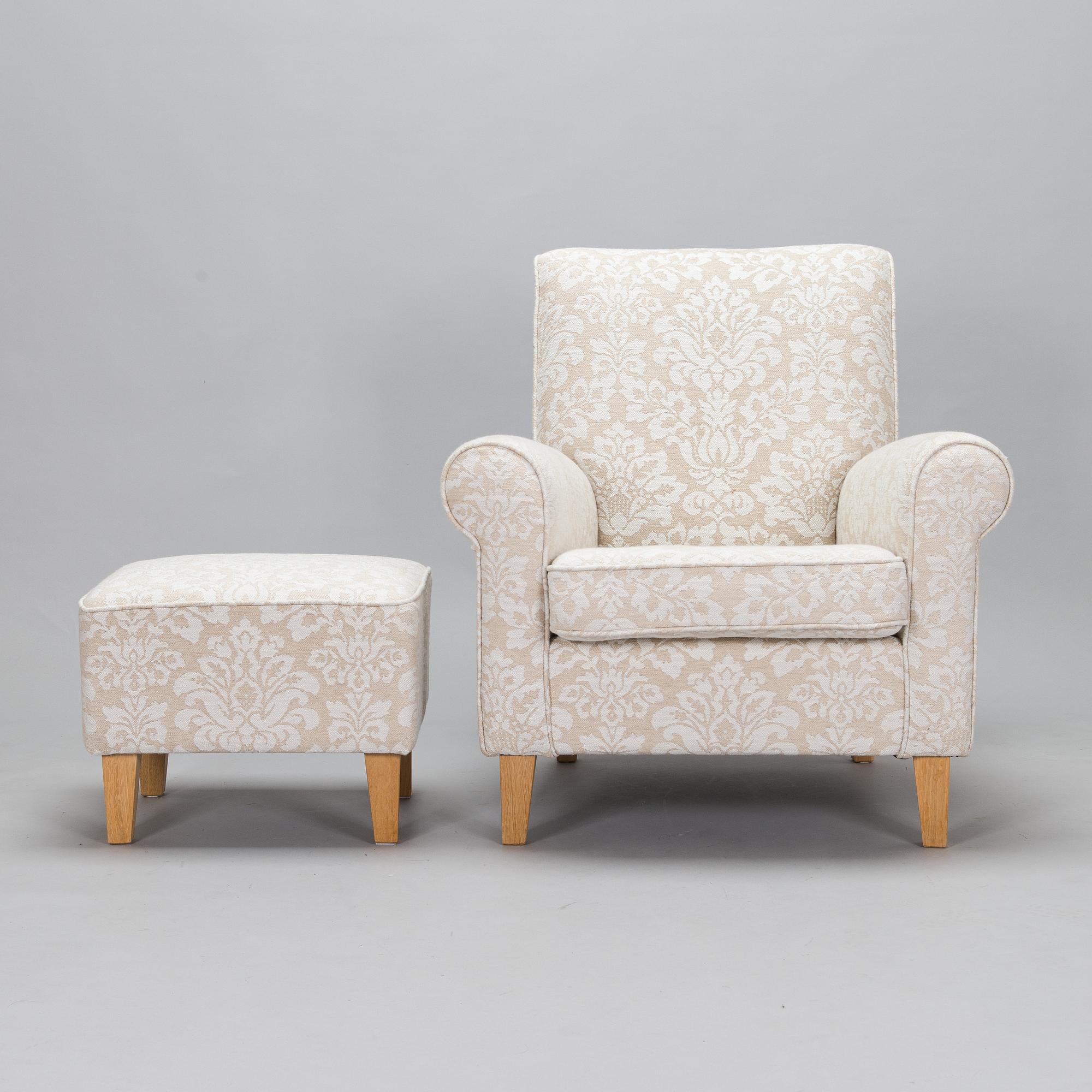 A mid-20th-century armchair and ottoman.