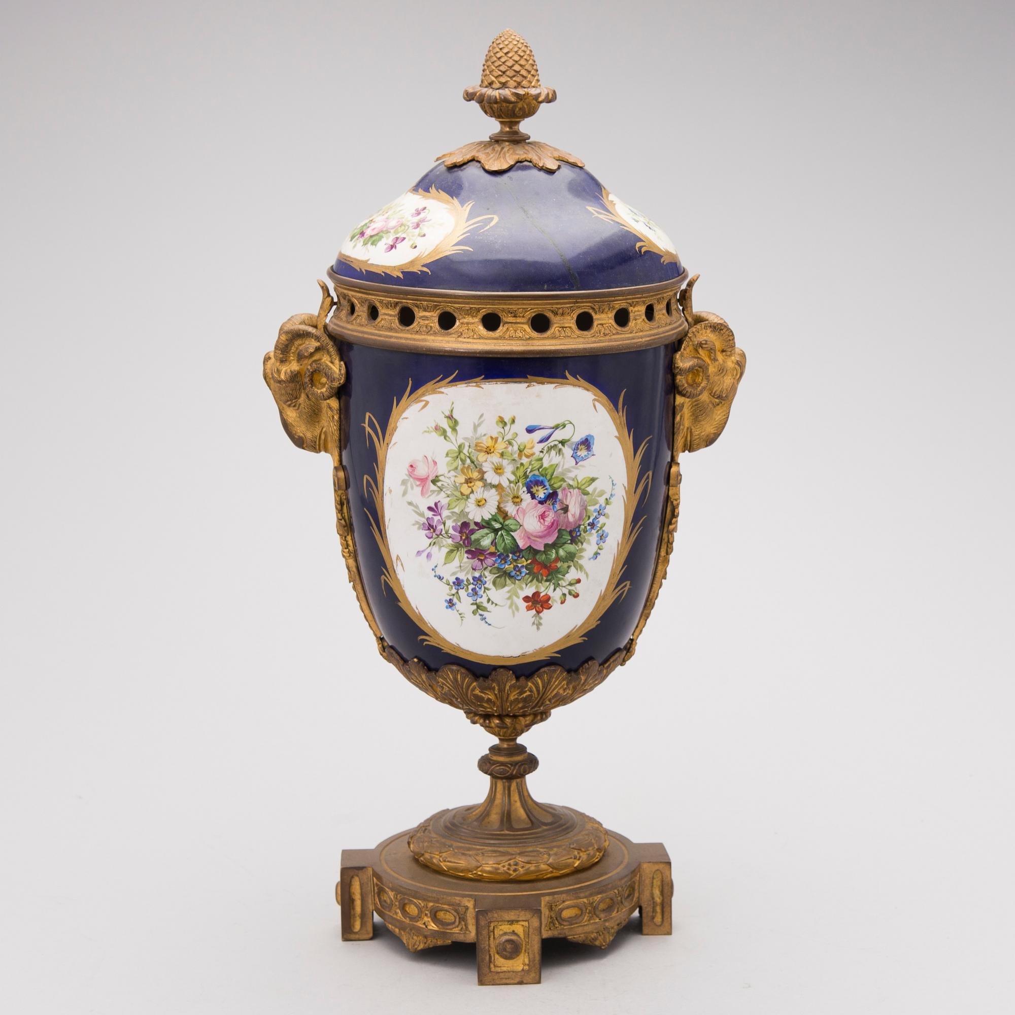 A FRENCH SÈVRES STYLE URN, porcelain and gilt bronze, latter half of the 19th century.