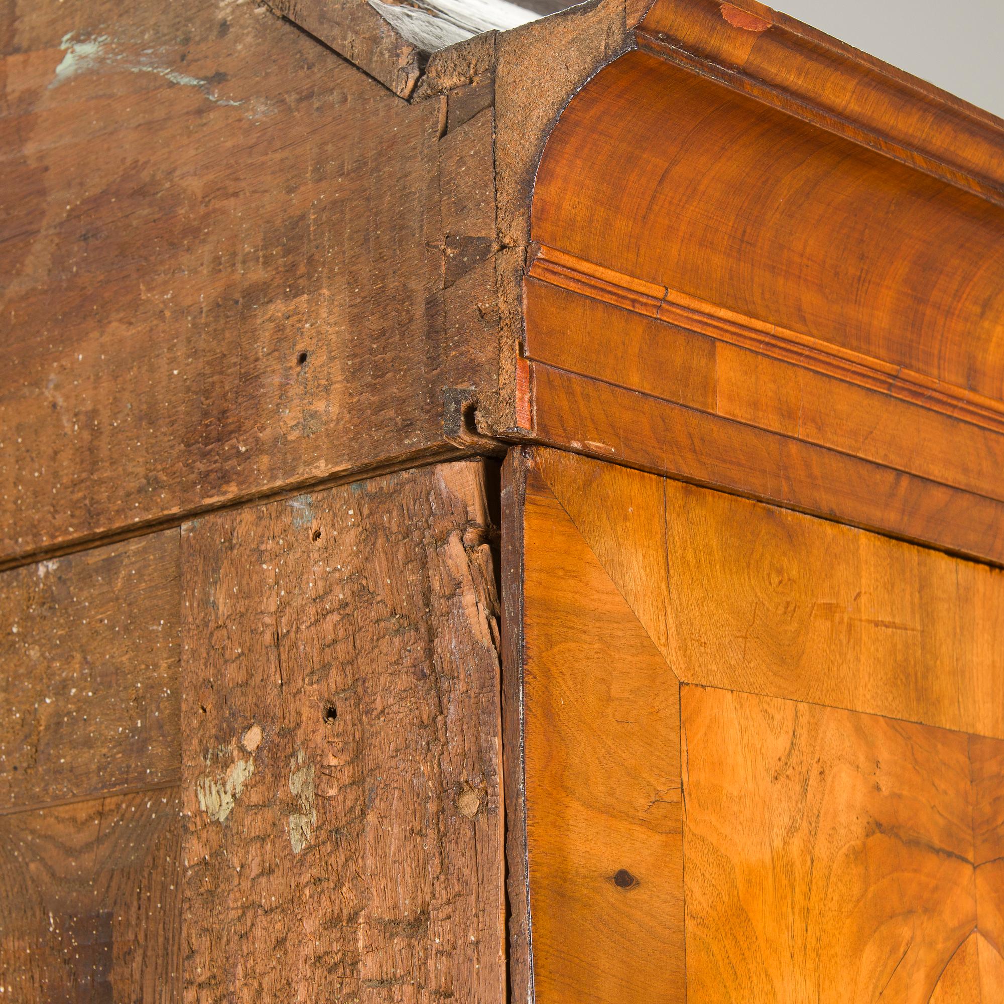A Swedish walnut-veneered rococo cabinet in the manner of C. Linning, latter half of the 18th Century.