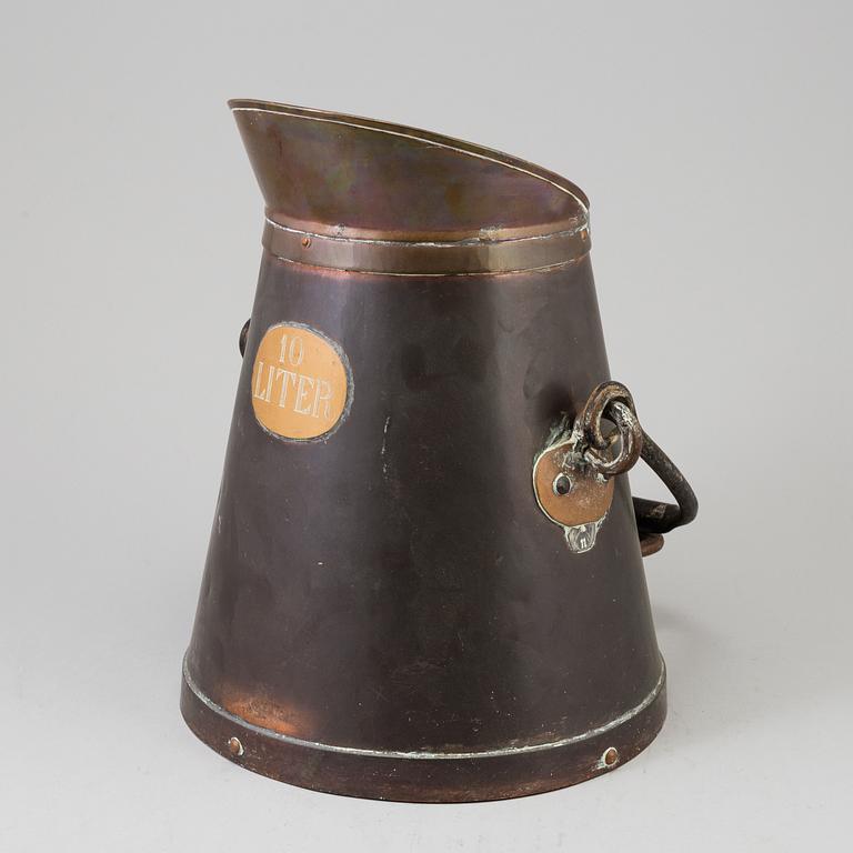 A copper pitcher, circa 1800.