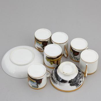 A group of seven cups, one with dish, Germany and France, 19th century.