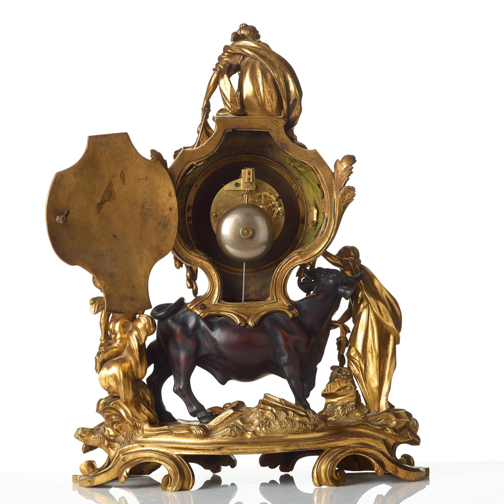 A Louis XV-style late 19th century mantel clock.