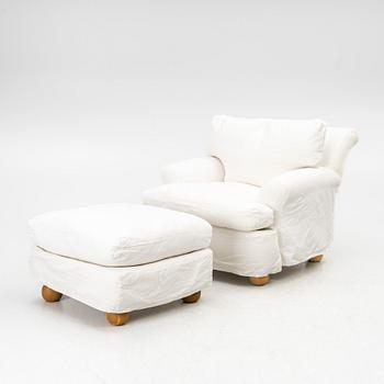An armchair with ottoman, contemporary.