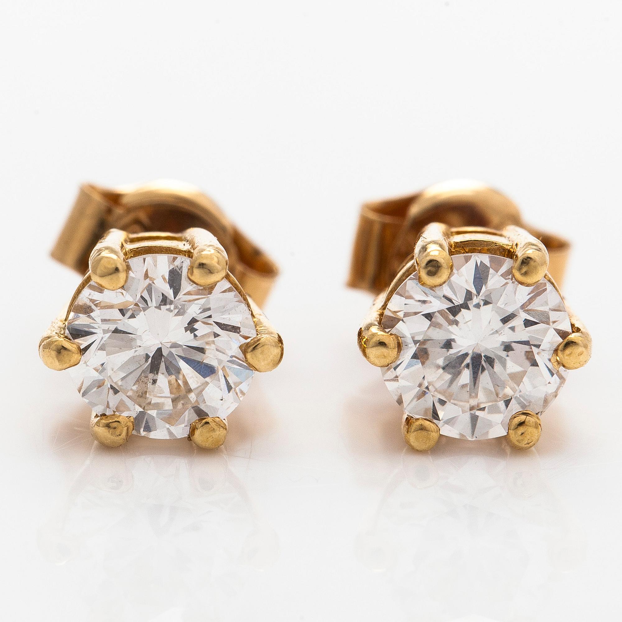 A pair of 18K gold earrings, with round brilliant-cut diamonds.