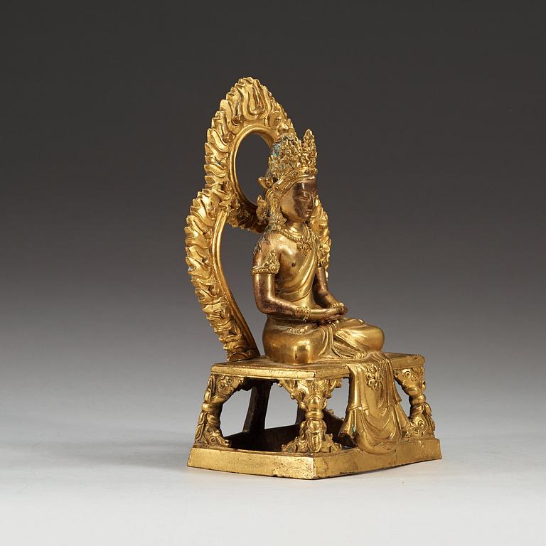 A gilt bronze figure of Bodhisattva, Qing dynasty, 18th Century. With inscription to base.