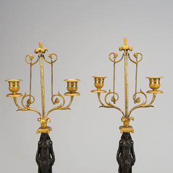 A pair of 1800s empire candelabras.