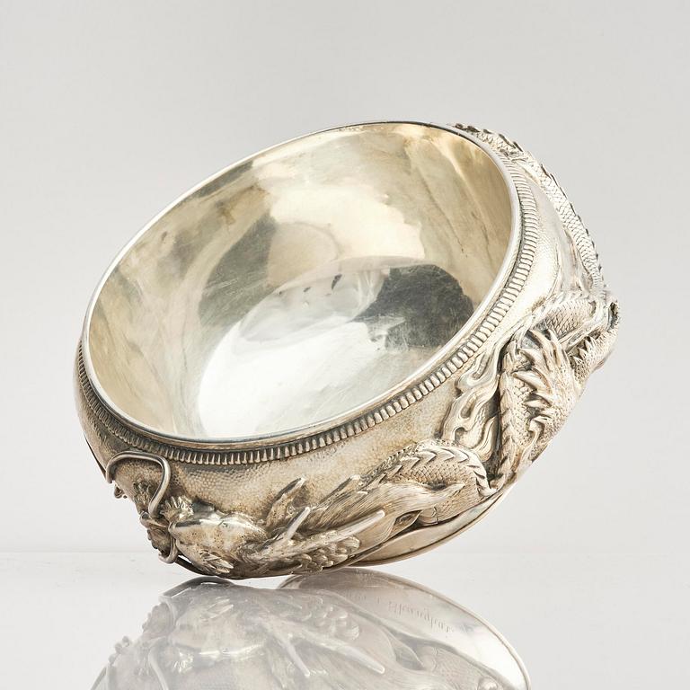 A Chinese double walled 'dragon' silver bowl, Shanghai, around 1900.