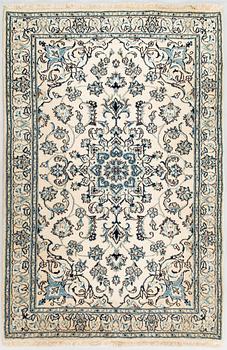 A carpet, Nain Part Silk. Ca 185 x 123 cm.