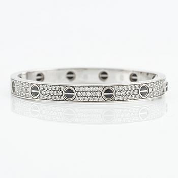 An 18K white gold Cartier bracelet "Love" with round brilliant-cut diamonds and ceramic.